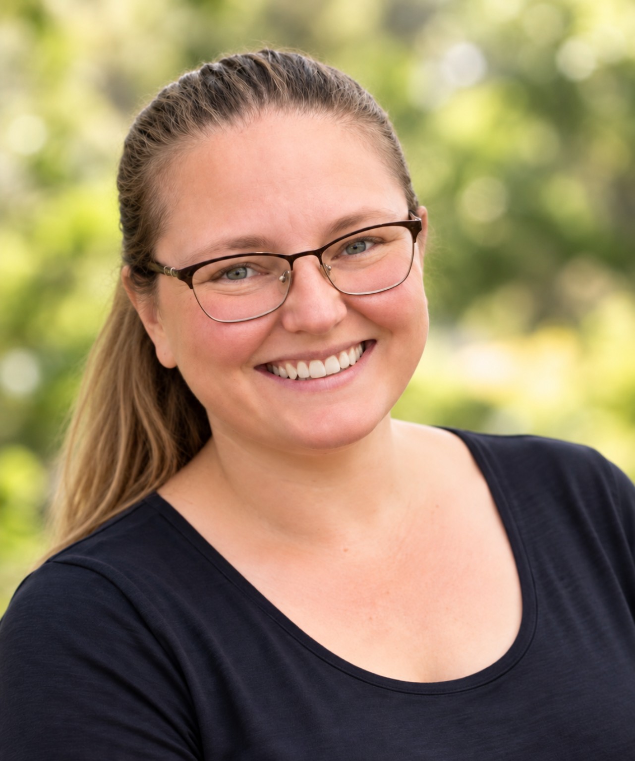 Kathleen Burroughs, founder of Buddy UP!, smiling outdoors